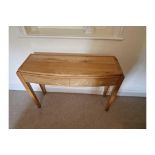 A Mellow Mahogany Two Drawer Console Table The Shaped Top Mounted On Square Legs 110 x 35 x 80cm