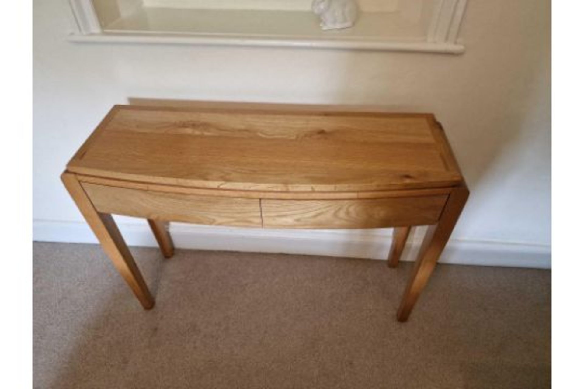 A Mellow Mahogany Two Drawer Console Table The Shaped Top Mounted On Square Legs 110 x 35 x 80cm