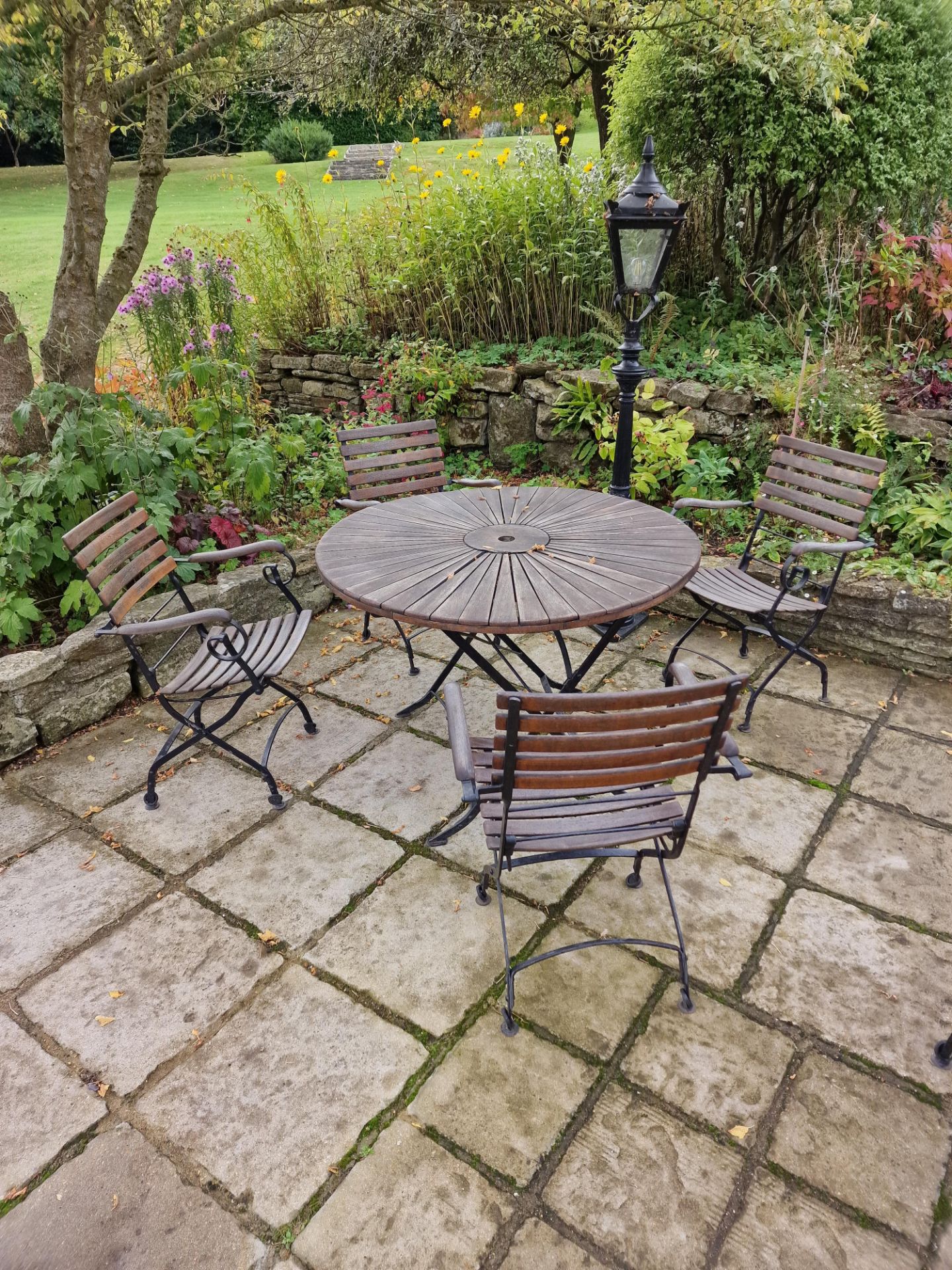 Danish Sunburst Teak Garden Table On Metal Legs Complete With 4 x Armchairs On A Foldable Cast