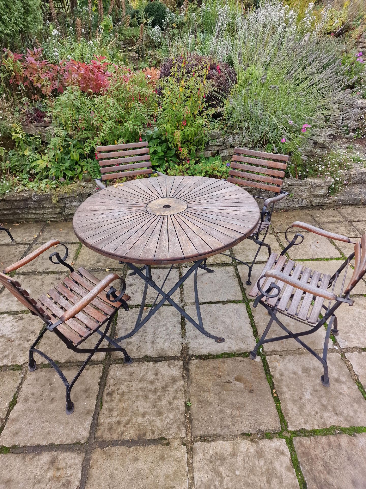 Danish Sunburst Teak Garden Table On Metal Legs Complete With 4 x Armchairs On A Foldable Cast