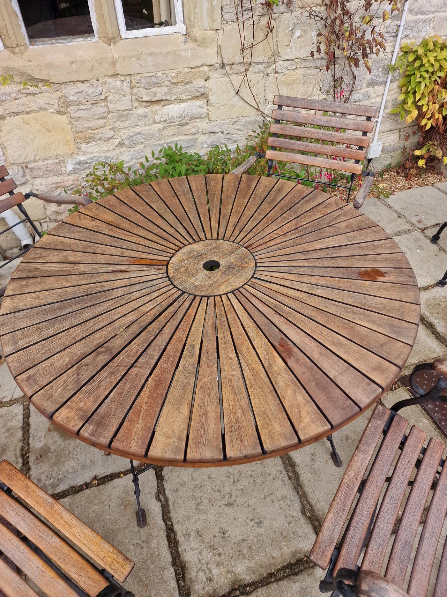 Danish Sunburst Teak Garden Table On Metal Legs Complete With 4 x Armchairs On A Foldable Cast - Image 2 of 2