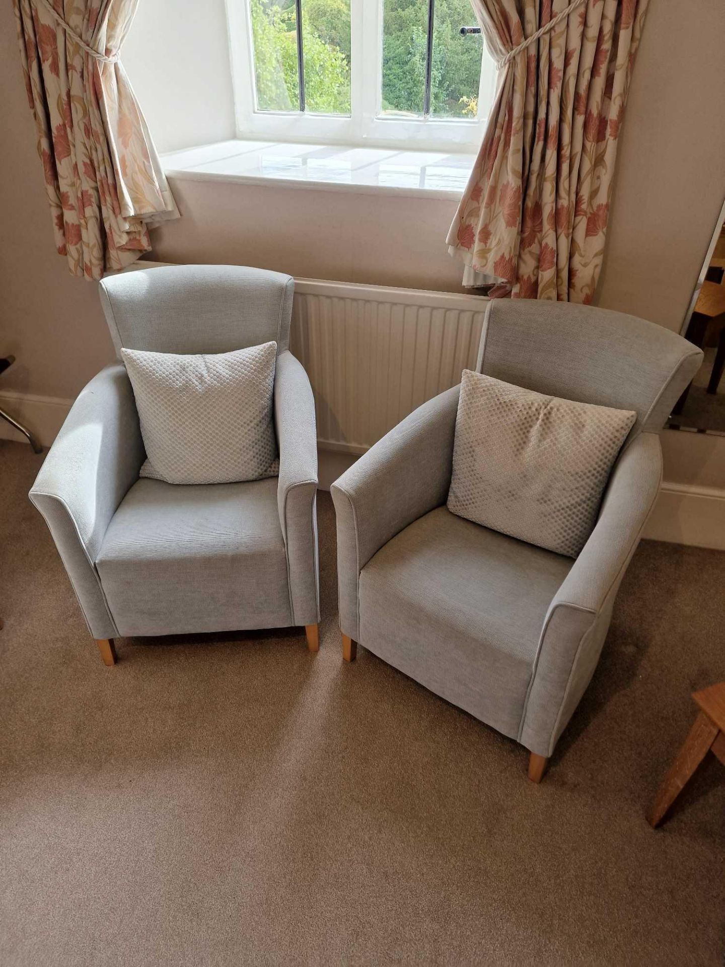 A Pair Of Pekalp London Armchairs Boasting A Classic Design With Button Back Detailing Upholstered