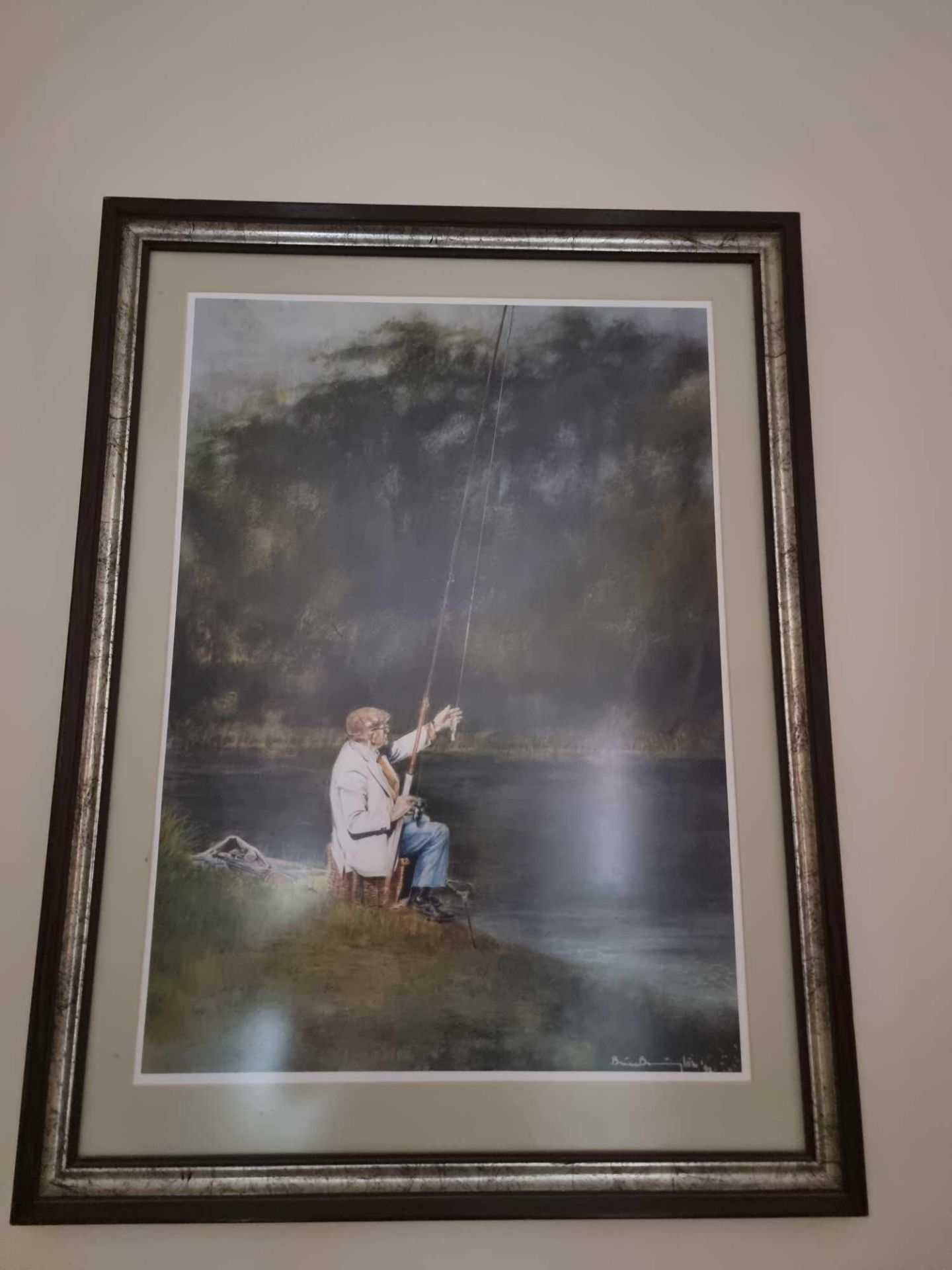 A Framed Print Of A Man Sitting By A River Fishing Signed Possibly By Brian Barrington Dated 92 In