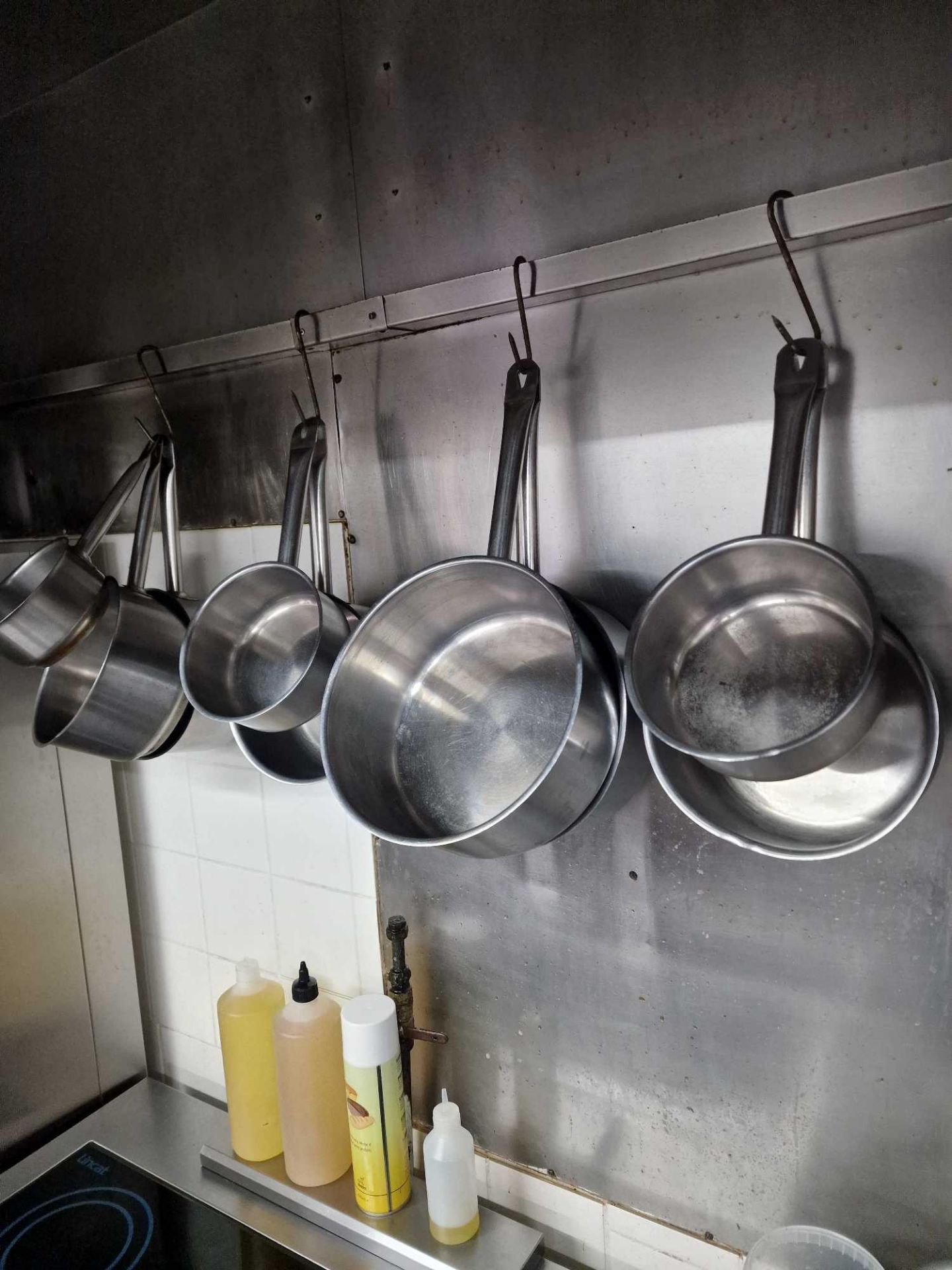 Various Stainless Steel Saucepans As Found