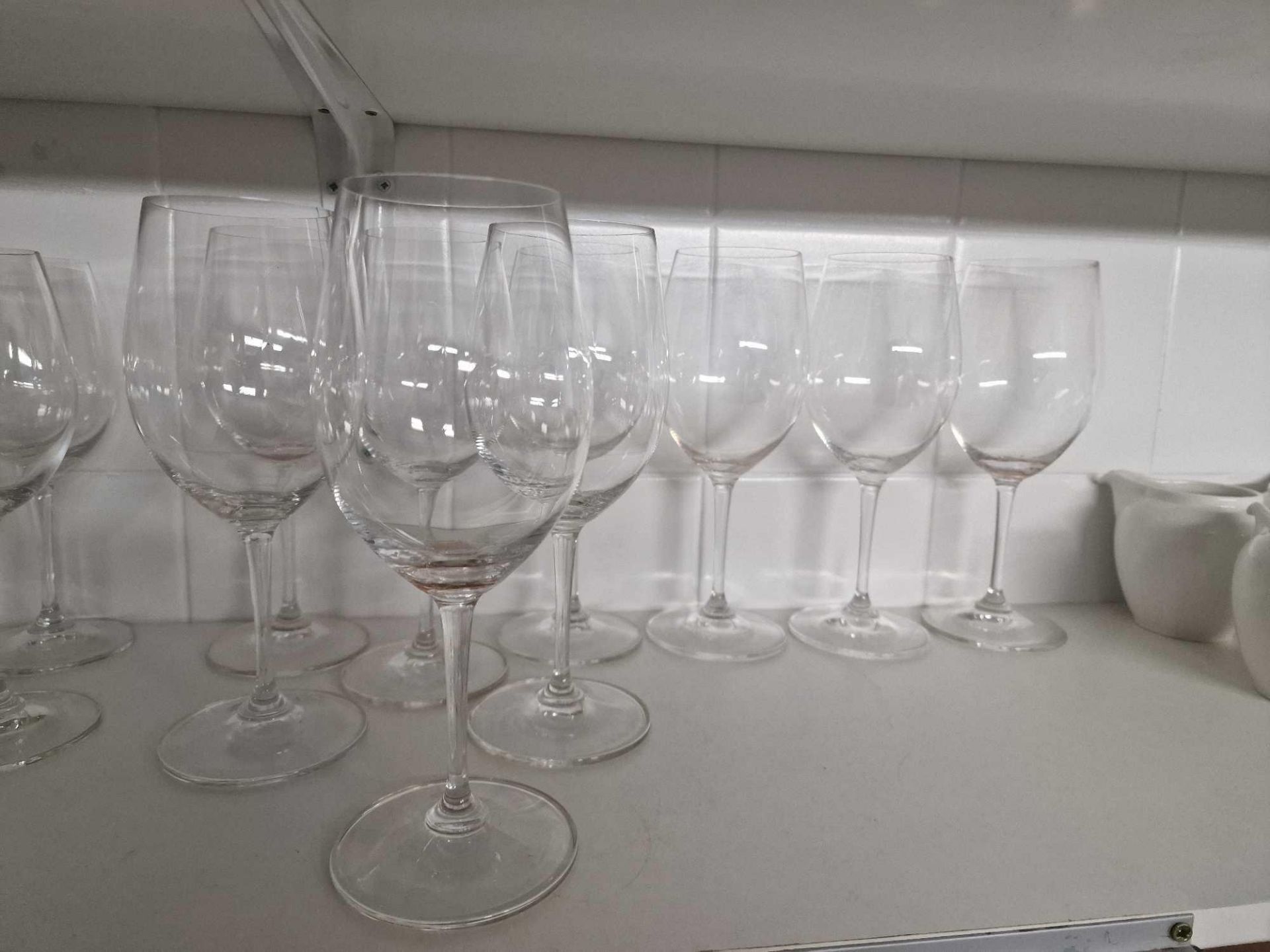 A Large Quantity Of Various Glassware As Found To Include Champagne Flues, Wine Glasses, Hiball