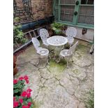 A Cast White Painted Bistro Table And 4 Chairs With A Spanish Influenced Design, With Intricately