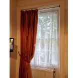A Single Panel Window Drape Curtain Red With Gold And Rust Sriped Pattern Throughout Mounted On