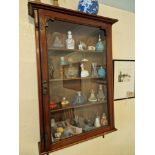 A Glazed Wooden Wall Mounted Display Cabinet To Include The Contents Of 24 X Various Vintage Perfume