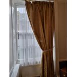 A Single Panel Drape Curtain In Gold Stripped Pattern On A Polished Brass Pole Spans 140 X 290cm (