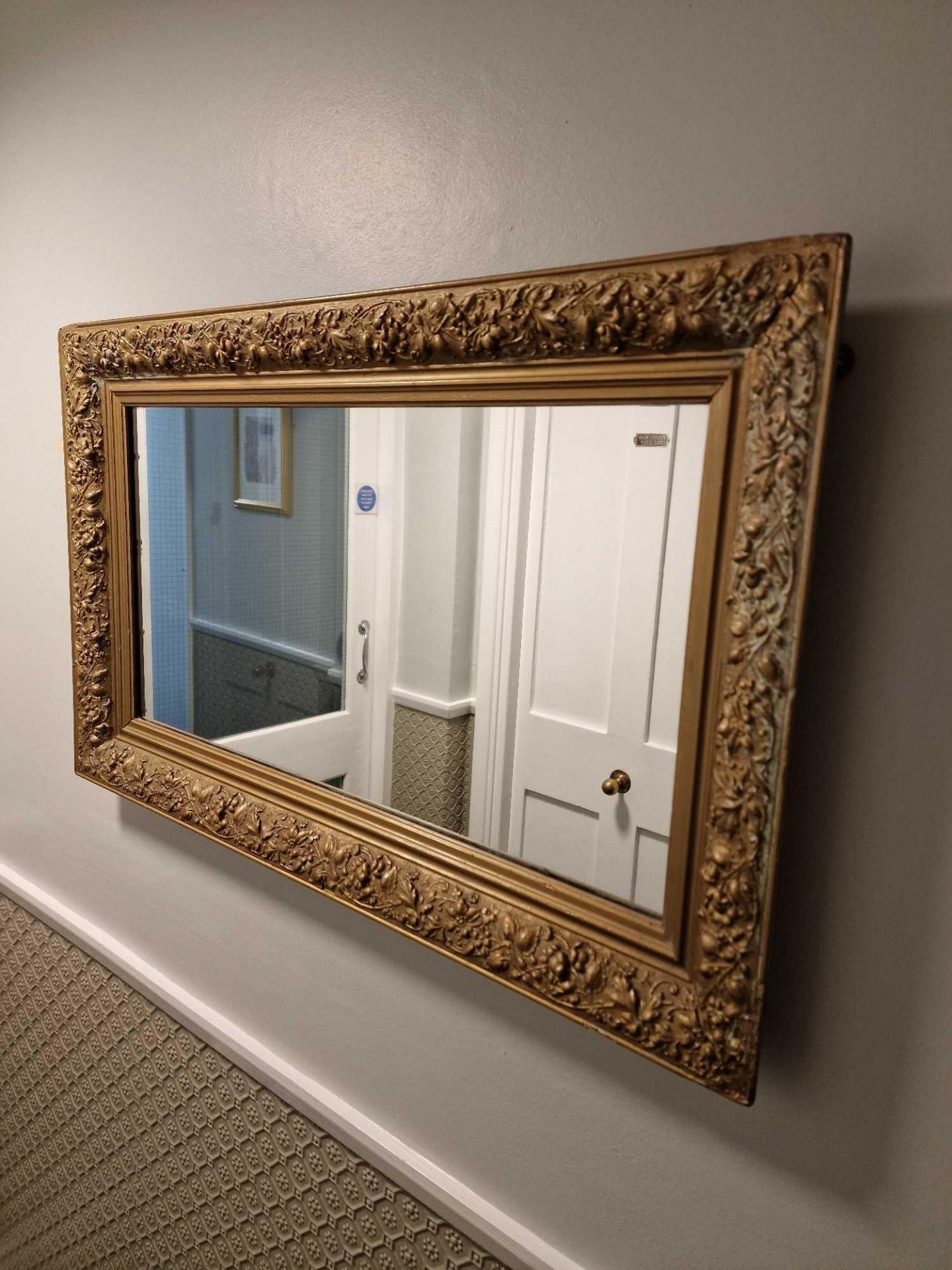 A Rectangular Gilt Wood Landscape Mirror The Frame Carved In Oak Leaves And Berries 88 X 54cm