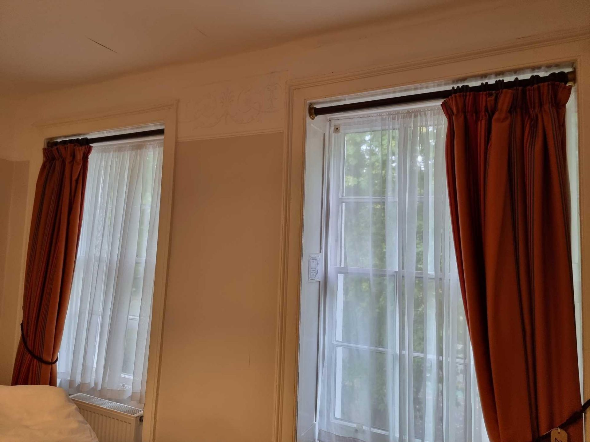 A Pair Of Drape Curtains Ring Top In Red Gold And Rust Stripe On Wooden Curtain Poles Span 200 X