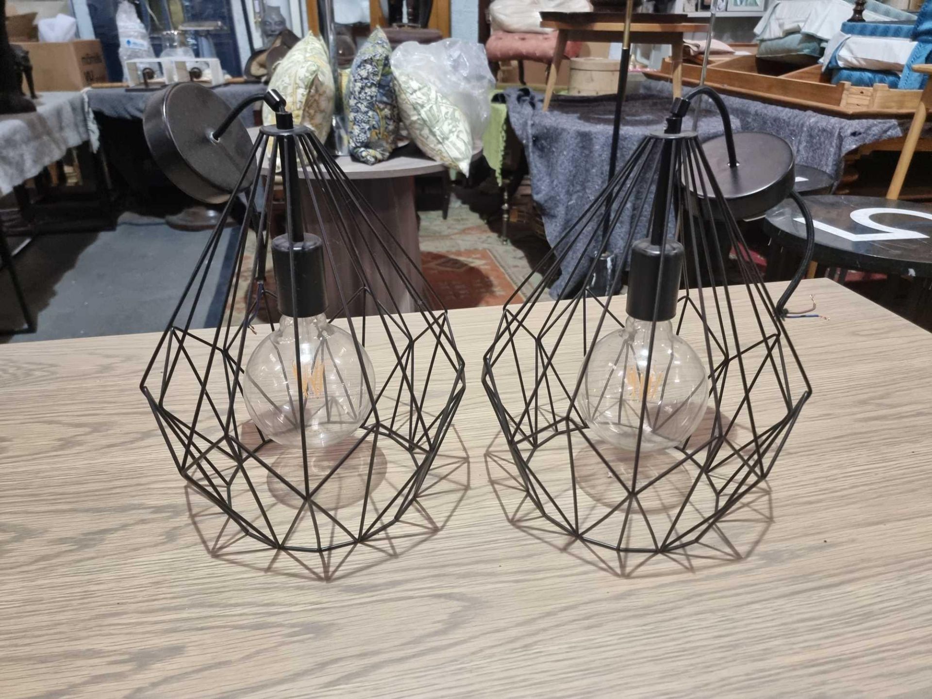 2 x Eglo Carlton Pendant Lights The Pendant Light Features A Black Diamond-Shaped Caged Body. The