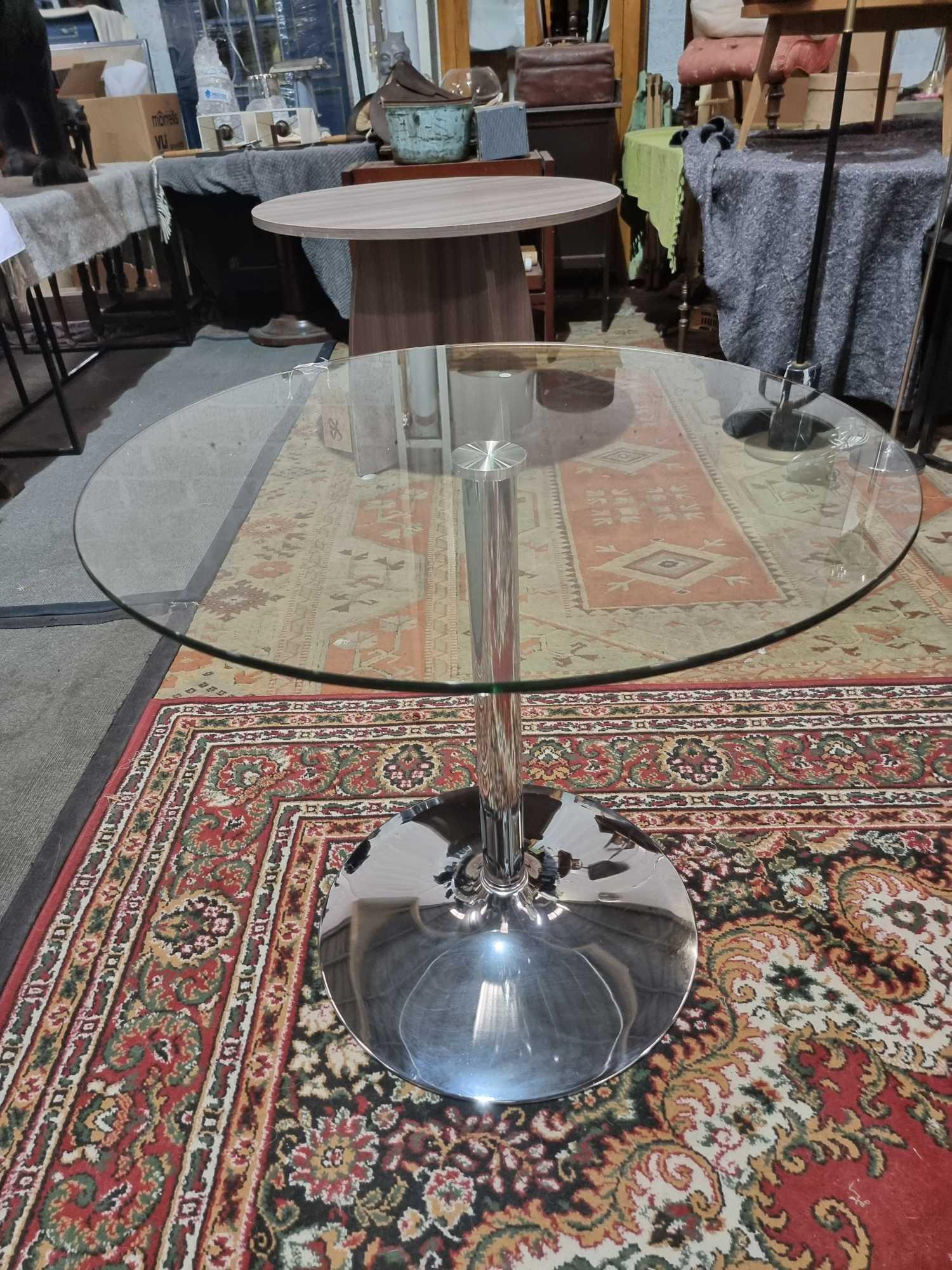 Glass And Stainless Pedestal Round Dining Table. Clear Tempered Glass Tabletop And A Smooth,