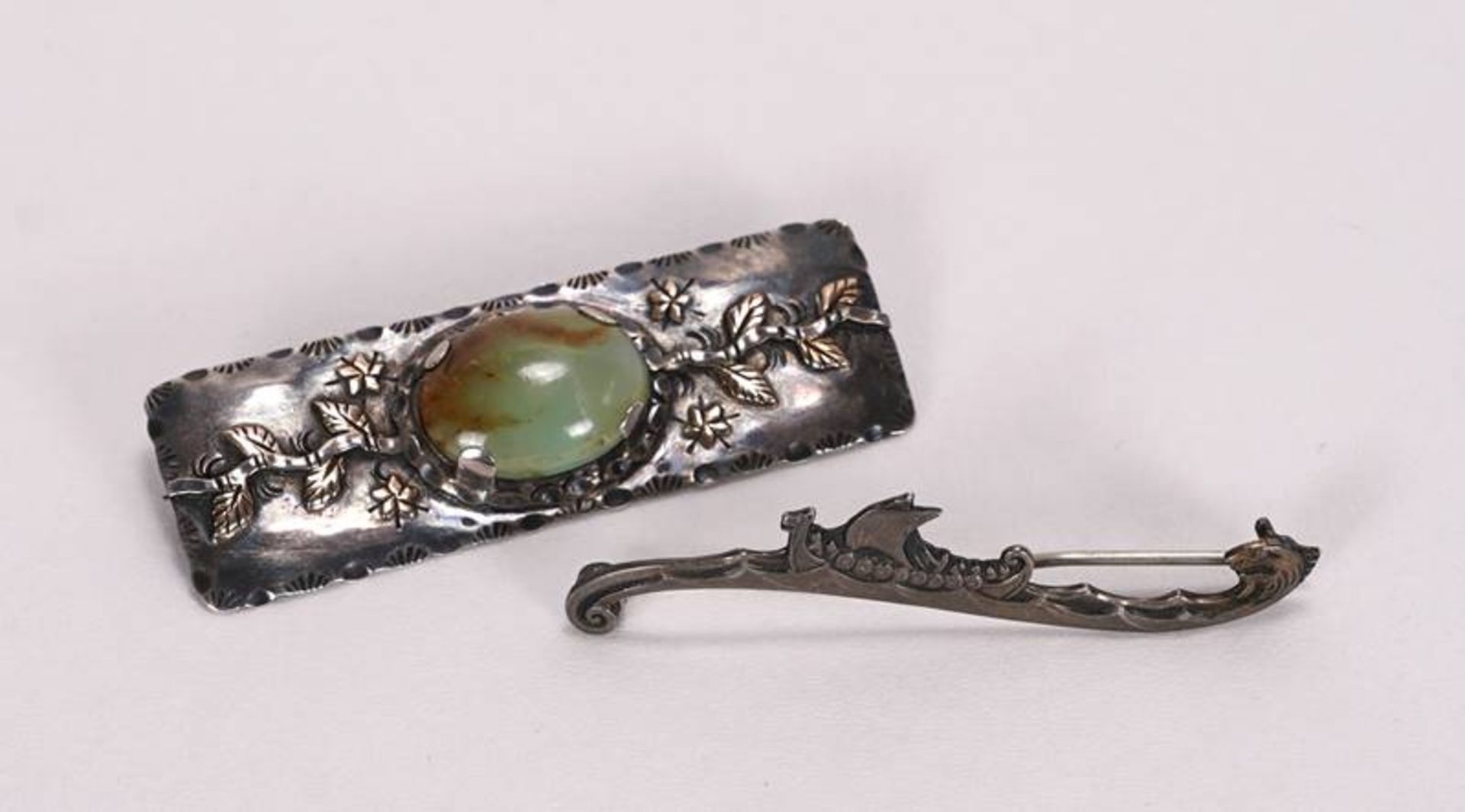 Two silver brooches