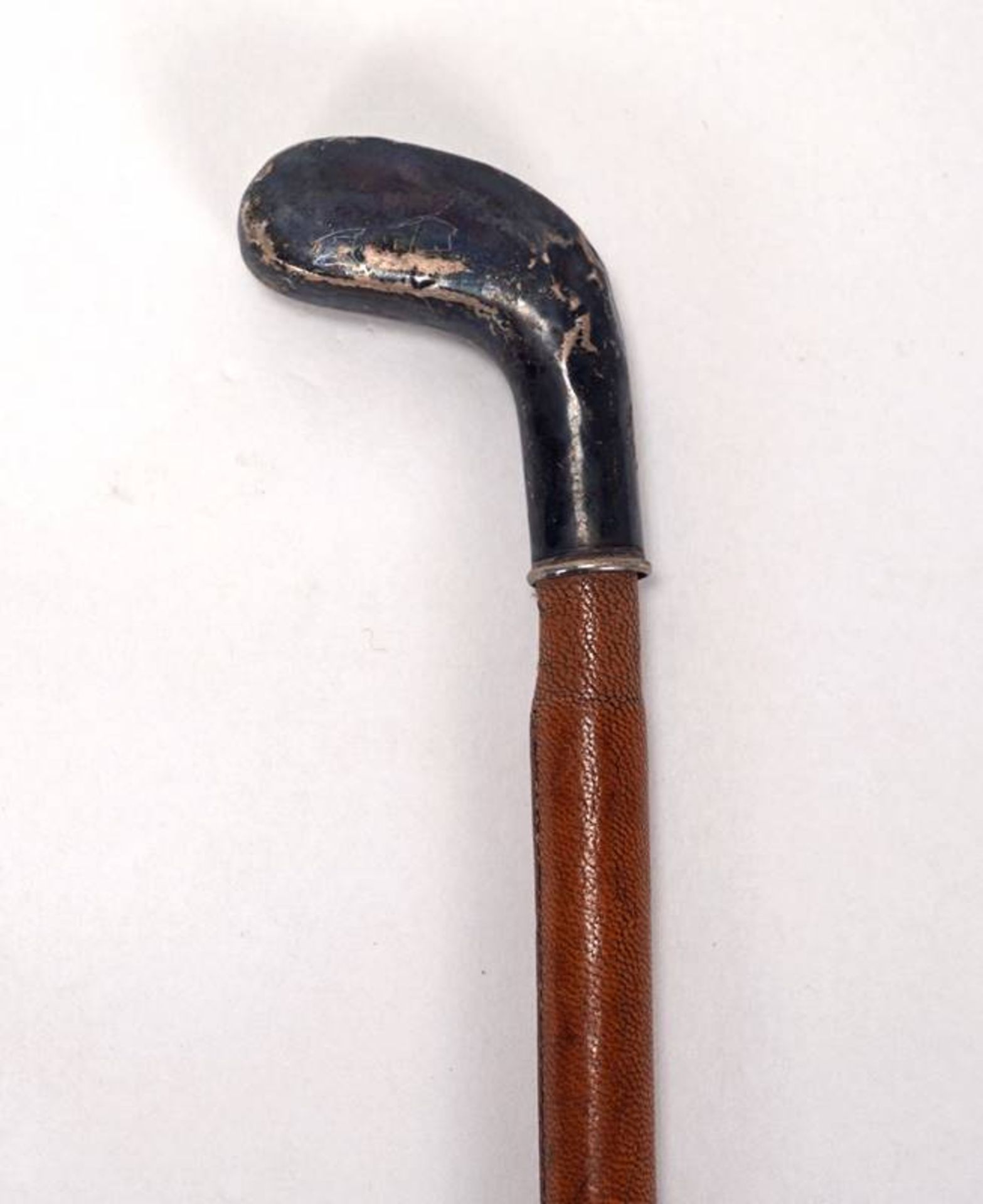 Riding crop with silver pommel