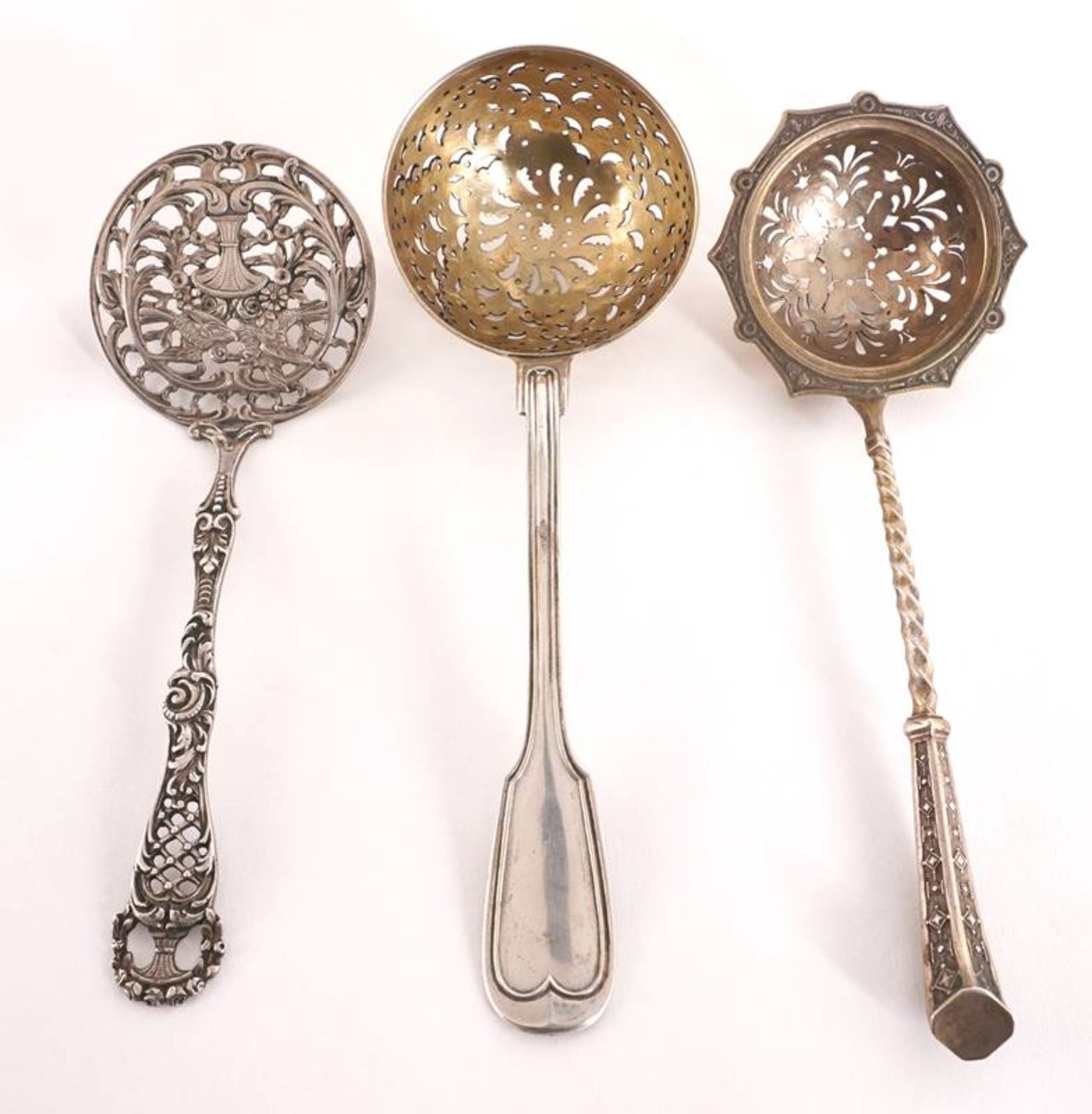 Three Slotted Spoons