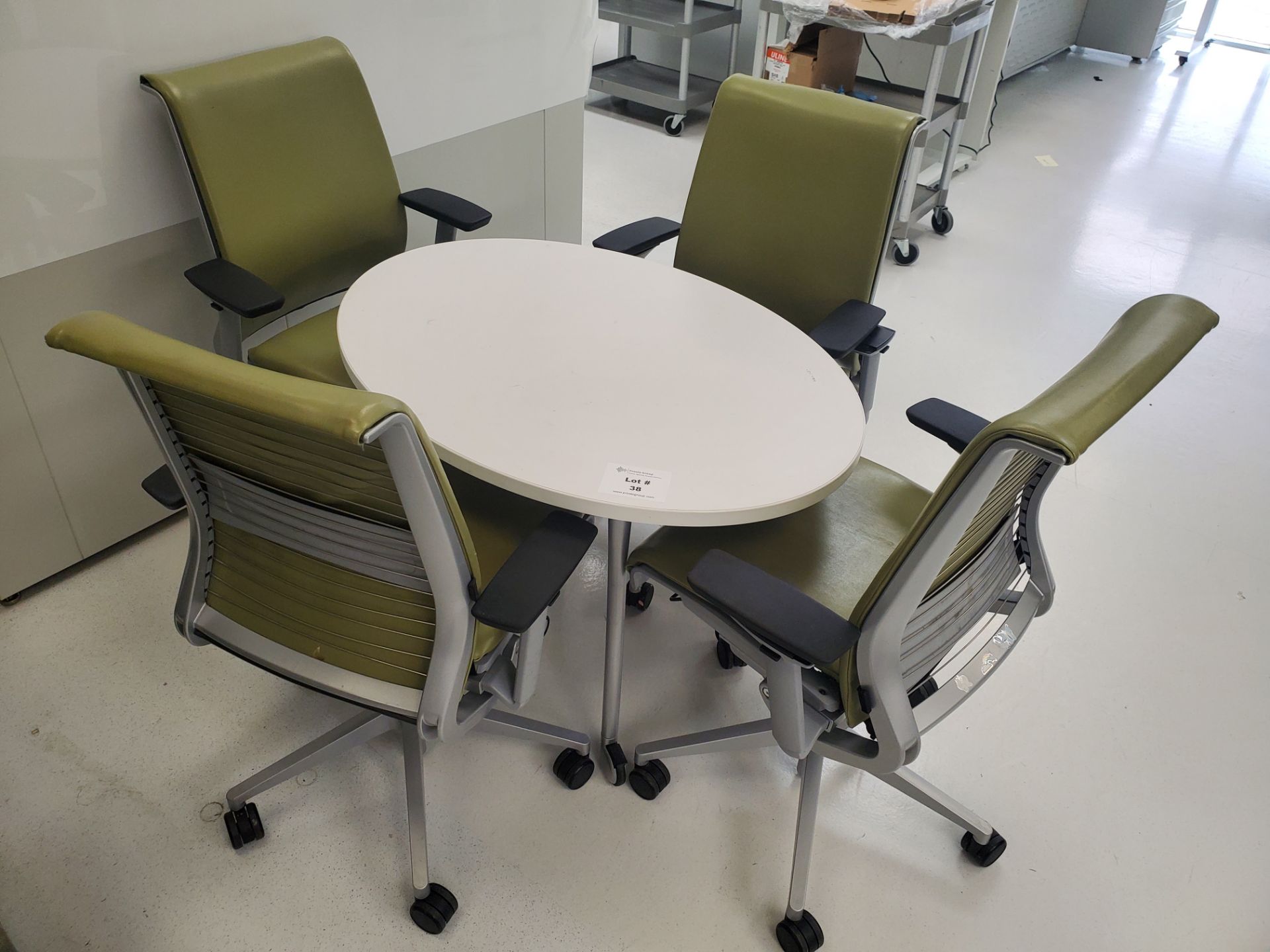 42" x 30" Oval Steelcase Table With (4) 5-Wheel Pneumatically Adjustable Swivel Base Office Chairs