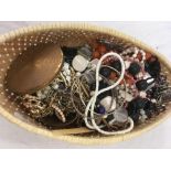 REED BASKET OF COSTUME JEWELLERY