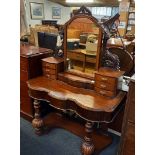 LATE VICTORIAN CARVED MAHOGANY DRESSING TABLE WITH MIRRORED BACK, DRAWERS WITH BRASS DROP