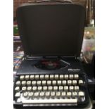 PORTABLE OLYMPIA TYPEWRITER IN CASE