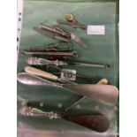 7 ASSORTED BUTTON HOOKS, 2 SILVER SHOE HORNS & VICTORIAN TIN CHILD'S CUTTLERY