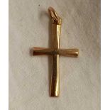 A SMALL 9ct GOLD CROSS WITH LOOP
