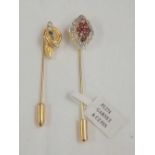 TWO GOLD COLOURED TIE PINS