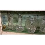 2 SHELVES OF 8 CUT GLASS DECANTERS & SPARE STOPPERS & GLASS WATER JUGS, ORNAMENTS ETC
