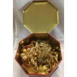 HEXAGONAL TIN WITH GOLD COLOURED COSTUME JEWELLERY, BANGLES, NECKLACES, EARRINGS, TIE PINS