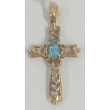 A SMALL GOLD CROSS INSET WITH AN AQUAMARINE