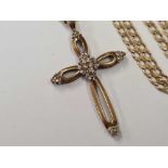 A 9ct GOLD CROSS WITH ROSE DIAMONDS ON A 9ct FLAT LINK NECK CHAIN