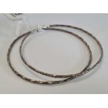 PAIR OF CHASED WHITE METAL BANGLES