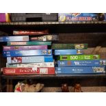 SHELF OF VARIOUS JIGSAW PUZZLES