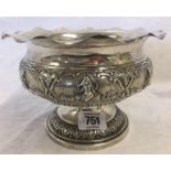 AN ANTIQUE INDIAN SWAMI SILVER BOWL WITH VARIOUS DEITIES IN SIX VIGNETTES STAMPED 90'S TO FOOT 5''