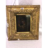 18THC OIL PAINTING ON OLD OAK PANEL; FIGURE SMOKING A PIPE IN A DOORWAY IN OLD ANTIQUE GILT FRAME