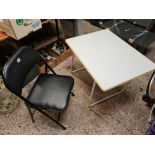 BLACK METAL FOLDING CHAIR & A WHITE FOLDING TABLE