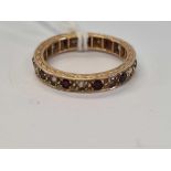 RED GARNET GOLD MOUNTED ETERNITY RING