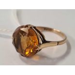 A SINGLE STONE TOPAZ RING SET IN 9ct