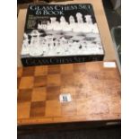 GLASS CHESS SET & BOOK & A WOODEN CHESS BOARD BOX WITH CHESS PIECES BY DANMAR