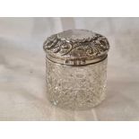 AN EMBOSSED VICTORIAN SILVER JAR, CUT GLASS BODY, B'HAM 1899