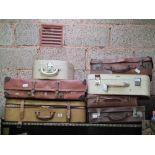 7 VARIOUS LEATHER FIBRE SUITCASES IN WORN CONDITION