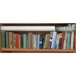 SHELF OF HARDBACK BOOKS, ROLLED MAPS OF TABLE BAY & REPRODUCTION NAVAL POSTERS