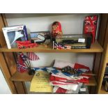 2 SHELVES OF MISC ITEMS INCL; A BOXED MODEL OF THE SUPER SONIC THRUST CAR, BRITISH AIRWAYS CONCORDE,