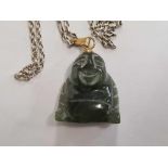 A CARVED GREEN STONE BUDDHA ON A SILVER NECK CHAIN 21'' LONG