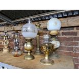 6 GLASS BODIED & BRASS OIL LAMPS WITH GLASS SHADES