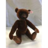 BROWN STEIFF NANDO TEDDY BEAR WITH A BRASS CASE COMPASS AROUND IT'S NECK