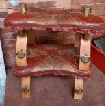 2 WOOD & LEATHER CAMEL STOOLS WITH BRASS DECORATION