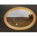 MODERN GILT FRAMED OVAL MIRROR