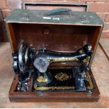 VINTAGE HAND POWERED SEWING MACHINE IN CASE