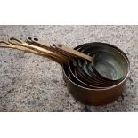 SET OF MODERN GRADUATED BRASS & COPPER SAUCEPANS & FRYING PAN SET